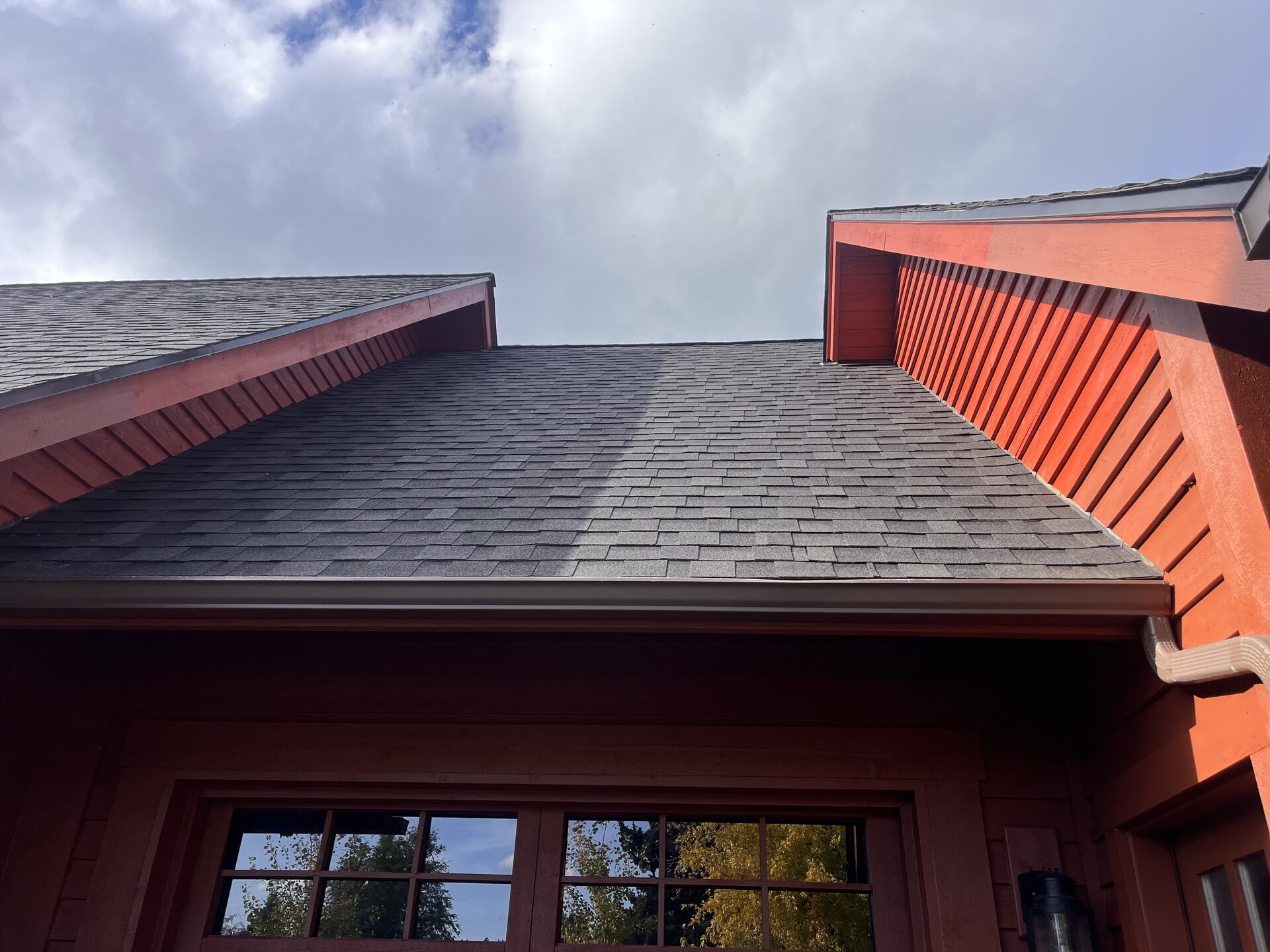 Log home roofline angle exterior painting North Idaho by Donner Painting