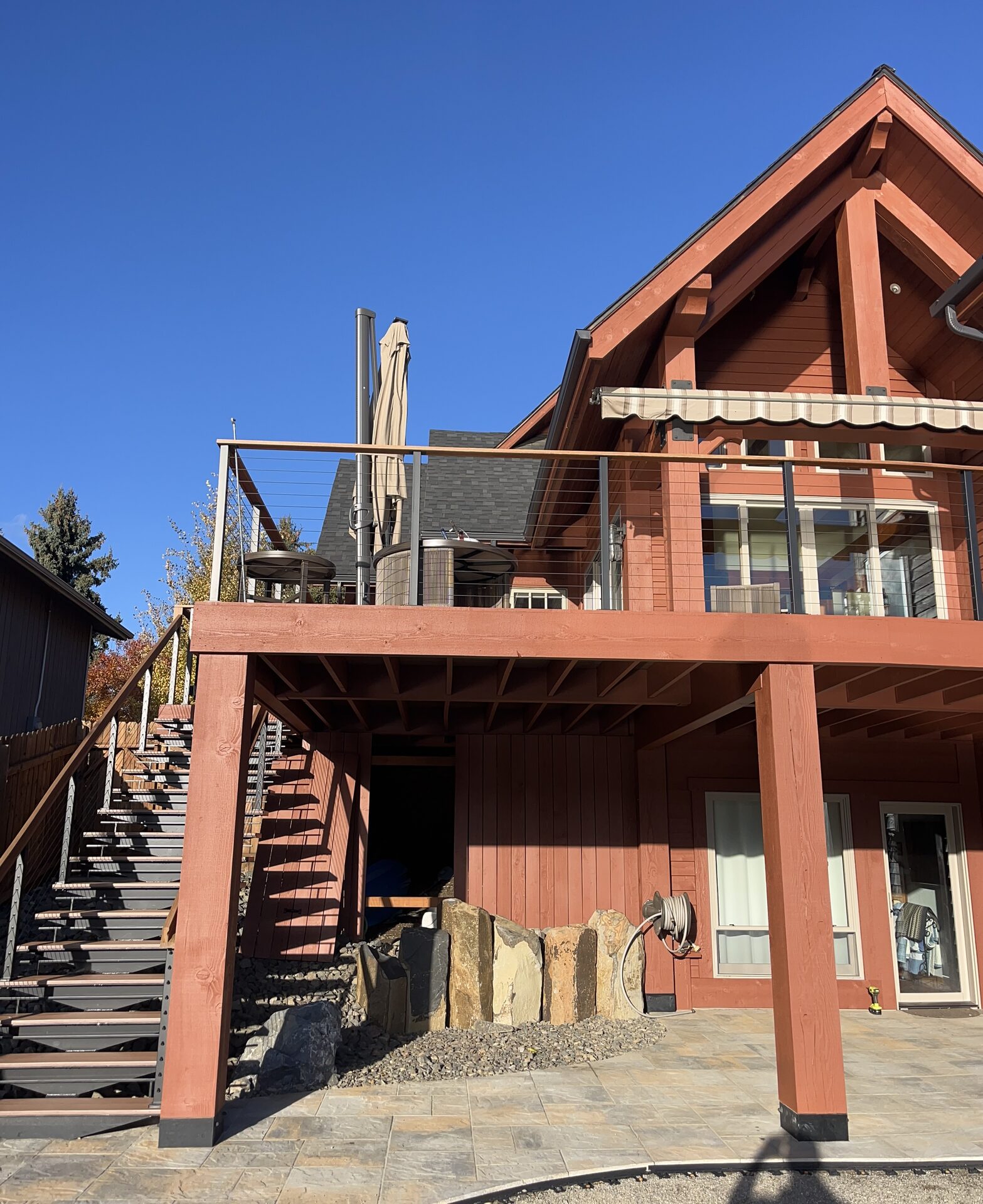 Log home rear deck and balcony exterior painting Coeur d'Alene