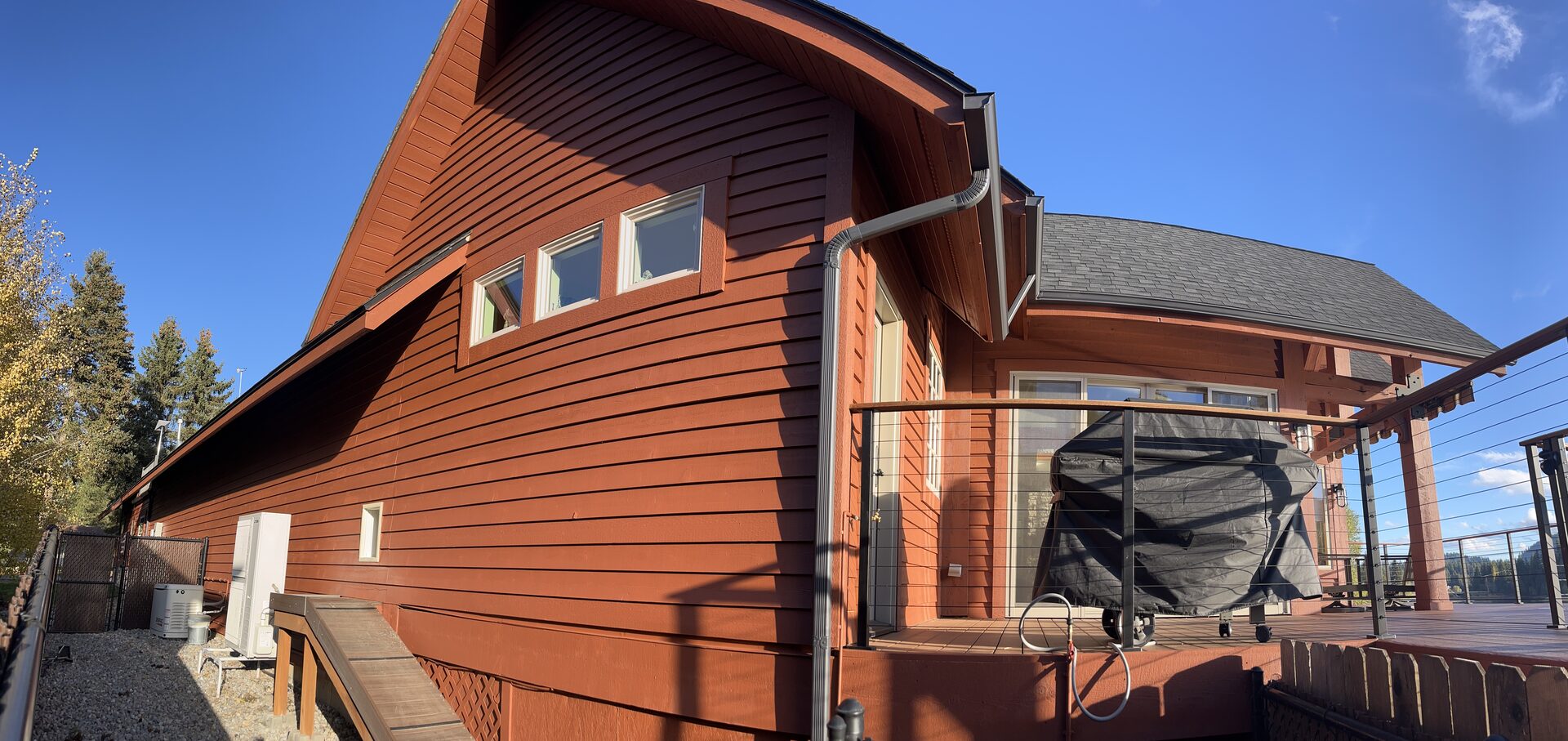 Large log cabin home exterior painting completed by Donner Painting Coeur d'Alene Idaho