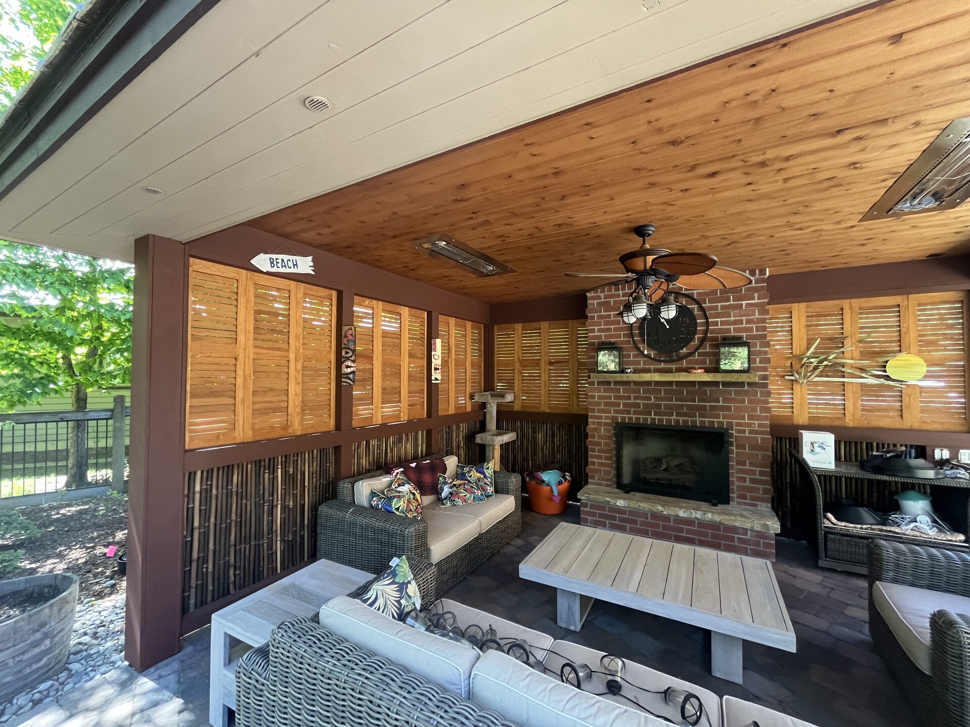 Outdoor fireplace and living space exterior staining by Donner Painting North Idaho